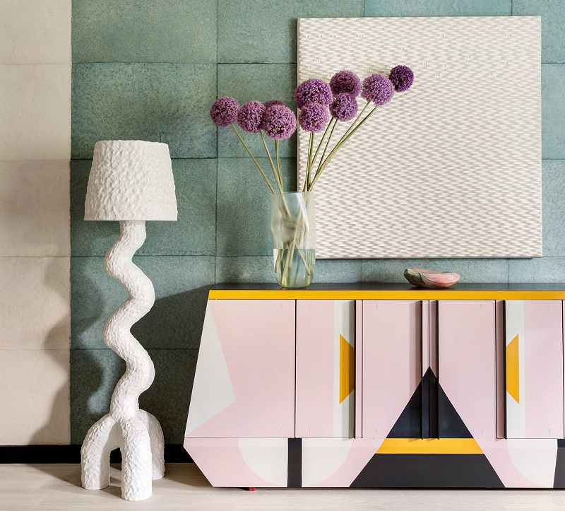 Colorful On Point interior design featuring sculptural lighting and custom cabinetry